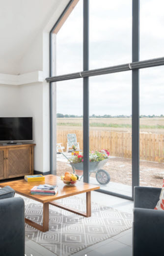 aluminium-window-behind-couple-on-bench